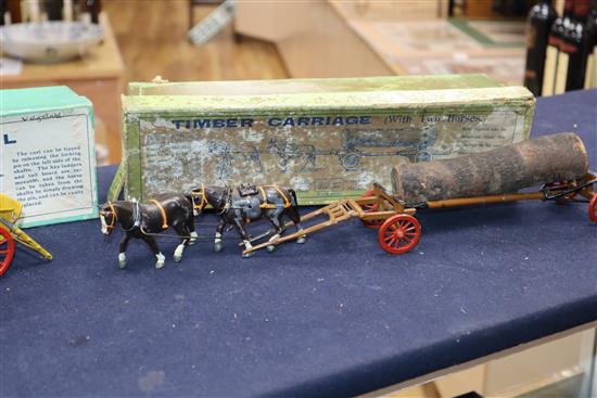 A collection of pre-war Britains Home Farm series models including a boxed farm wagon, boxed timber carriage, boxed tumbrel horse